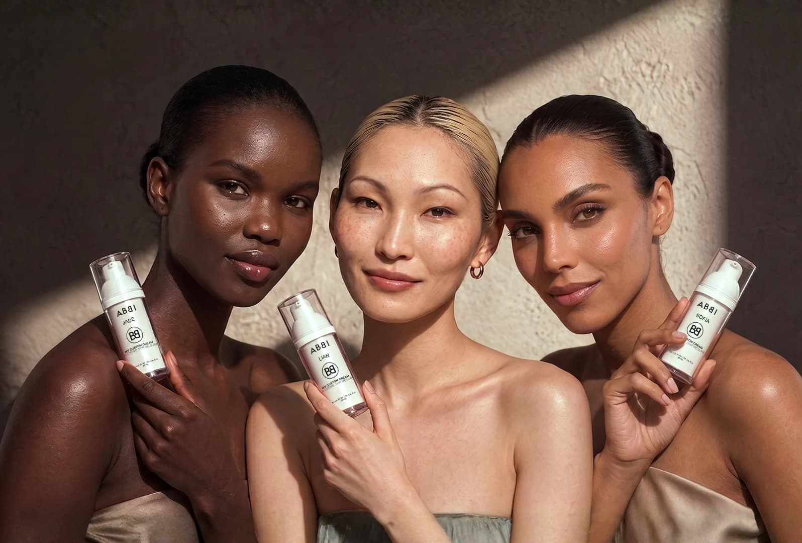 Three women holding their ABBI Custom Cream